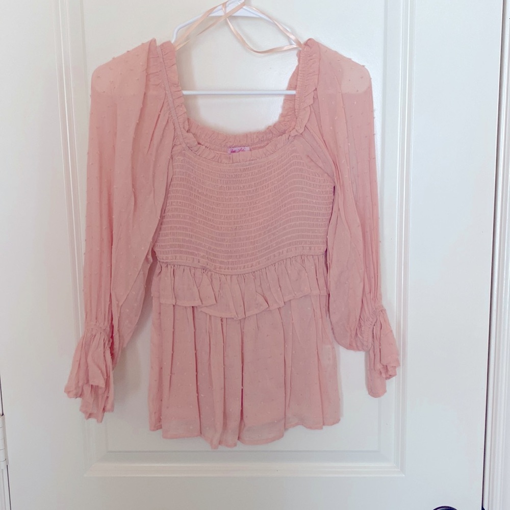 Ruffle detail half sleeve top. Peachy colored.